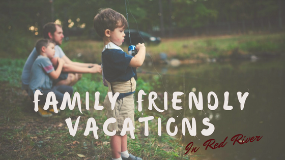Family Friendly vacations. Small boy with camera outdoors