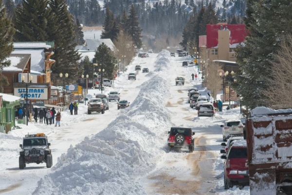 small town with snow and jeeps